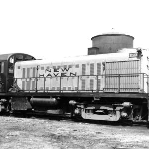 Broadside View of the engineer's side of RS-2 number 0513 with diesel locomotives in the background