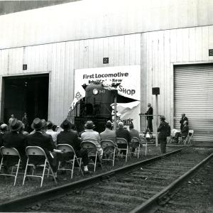 RS-3 #542 1st rebuilt loco at Lamberton Street diesel shop - loco ripping through banner at ceremony held at the south end of the new car shop.