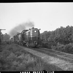 A trio of RS-3s lead by #524 heading a freight train on single track line