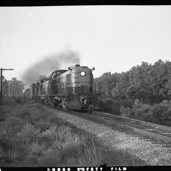 A trio of RS-3s lead by #524 heading a freight train on single track line